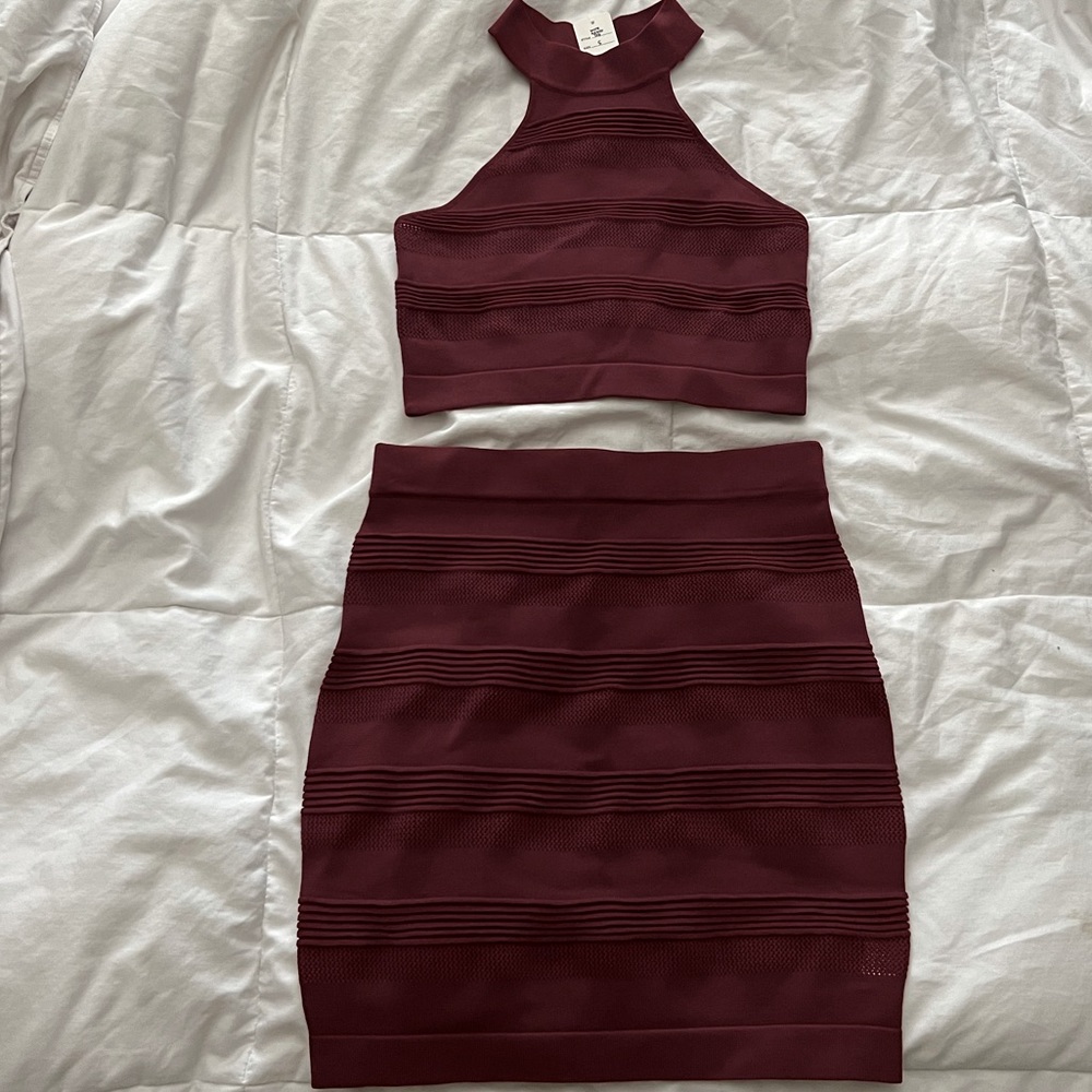 Dark red, brand new 2 piece top/skirt